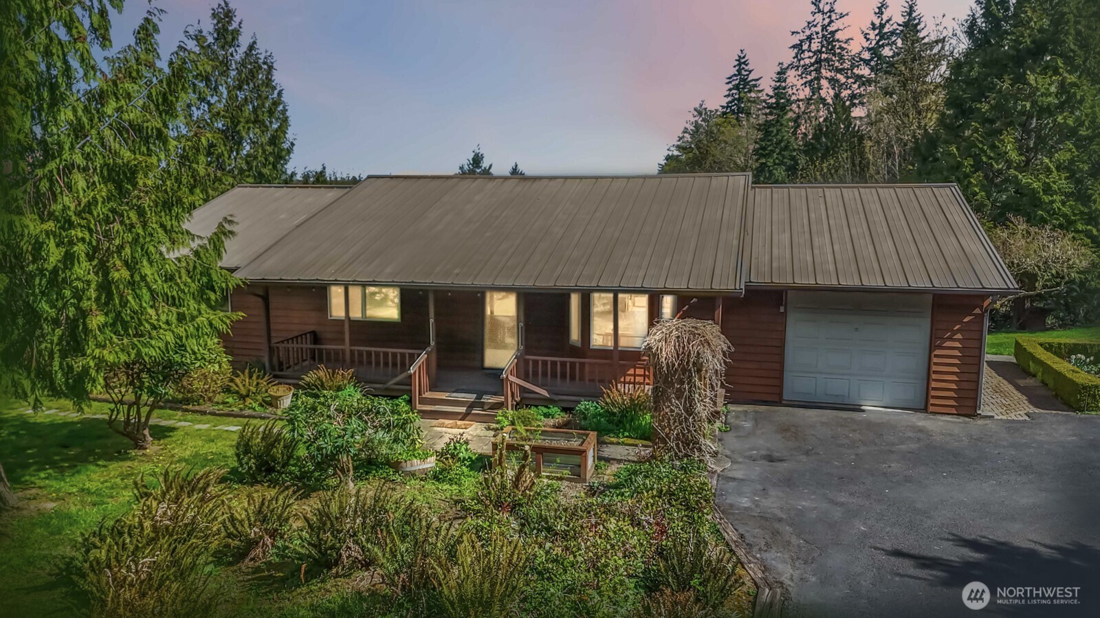207 Tillicum Drive Chehalis, WA 98532 - Photo 2 of 40 a aerial view of a house with table and chairs under an umbrella