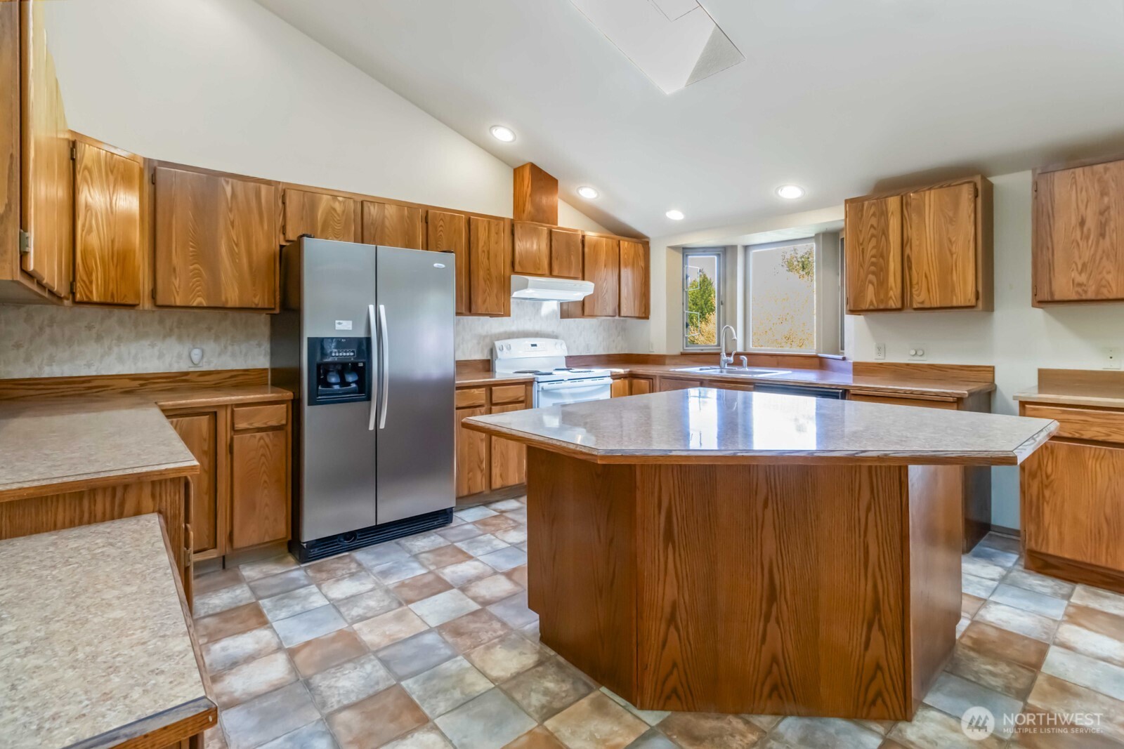 207 Tillicum Drive Chehalis, WA 98532 - Photo 25 of 40 a kitchen with stainless steel appliances granite countertop a refrigerator a sink a stove a microwave and island