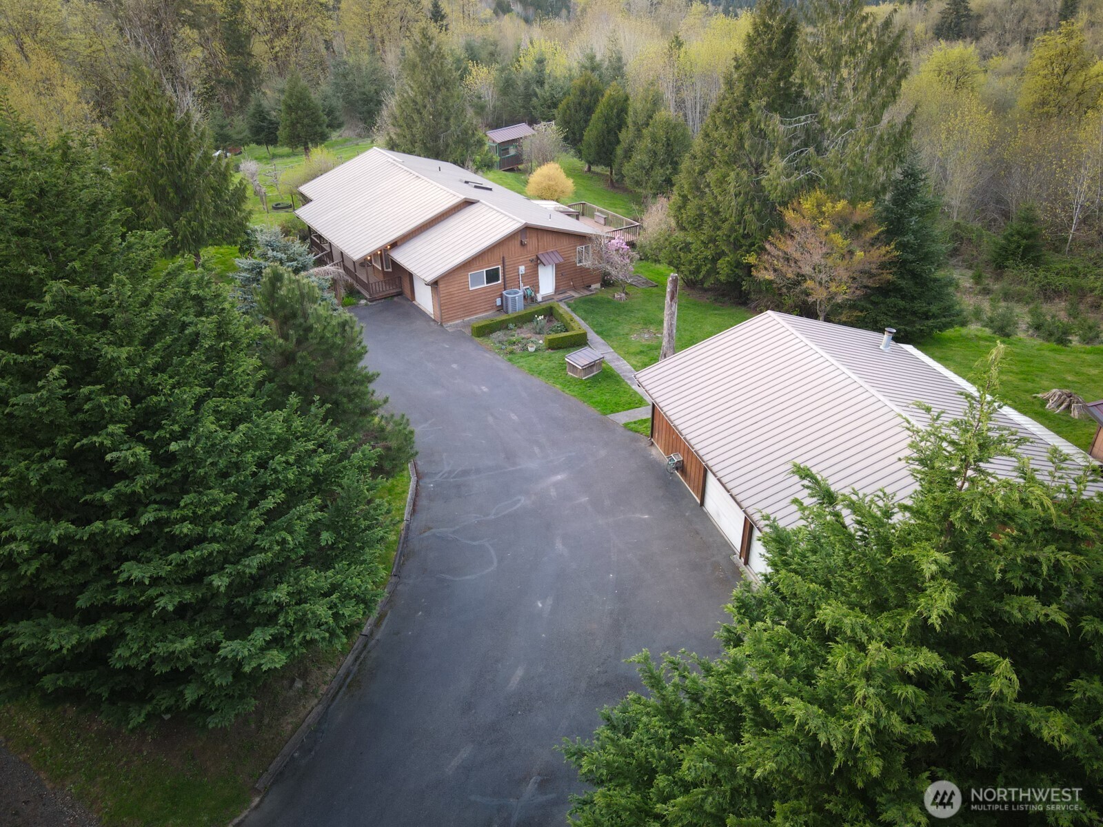 207 Tillicum Drive Chehalis, WA 98532 - Photo 4 of 40 an aerial view of a house with a yard and lake view