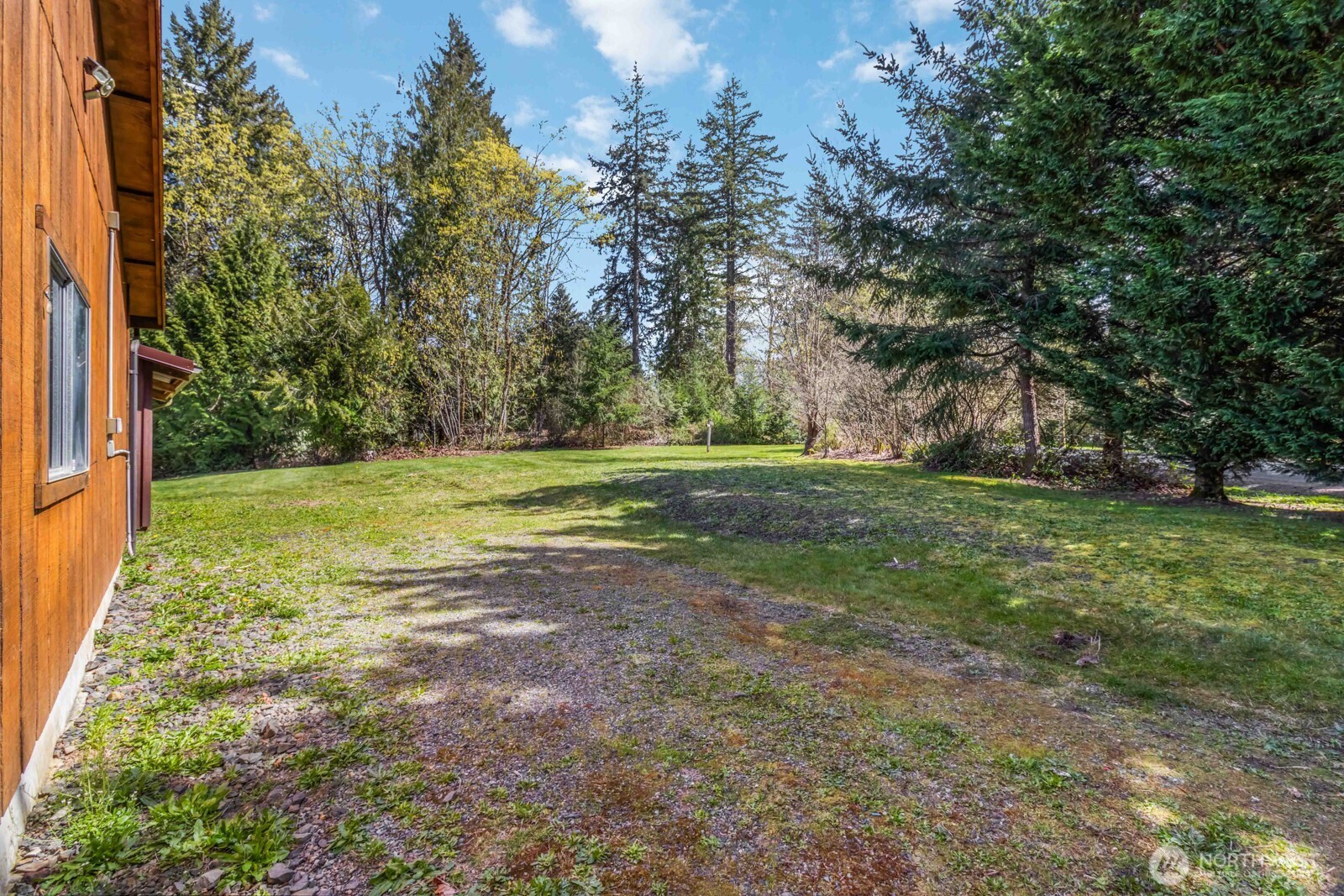 207 Tillicum Drive Chehalis, WA 98532 - Photo 6 of 40 a view of a field with trees in the background