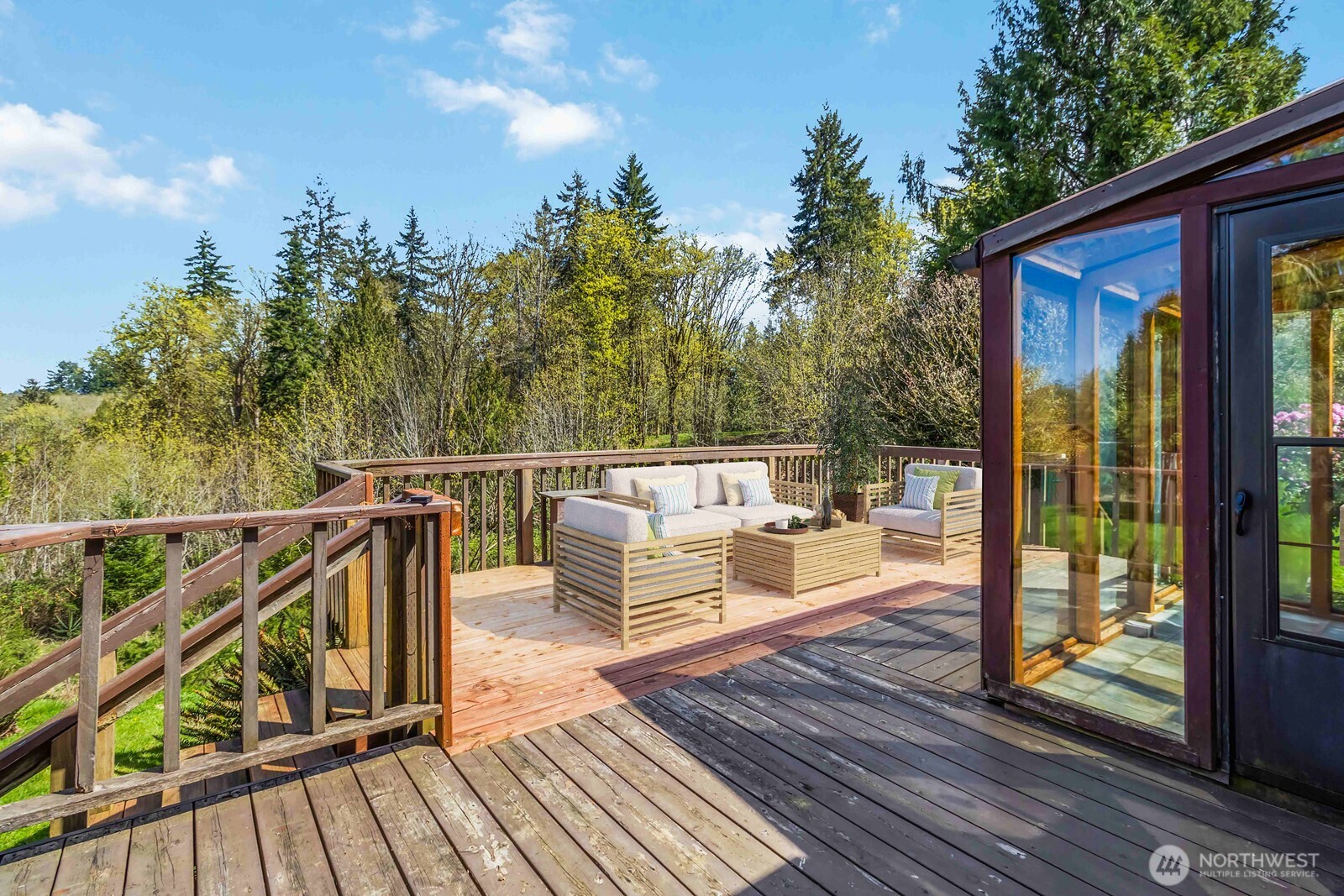 207 Tillicum Drive Chehalis, WA 98532 - Photo 10 of 40 a view of a balcony with chairs and wooden floor