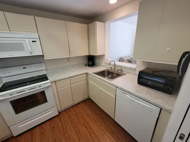 a bedroom with a bed and a dresser in it