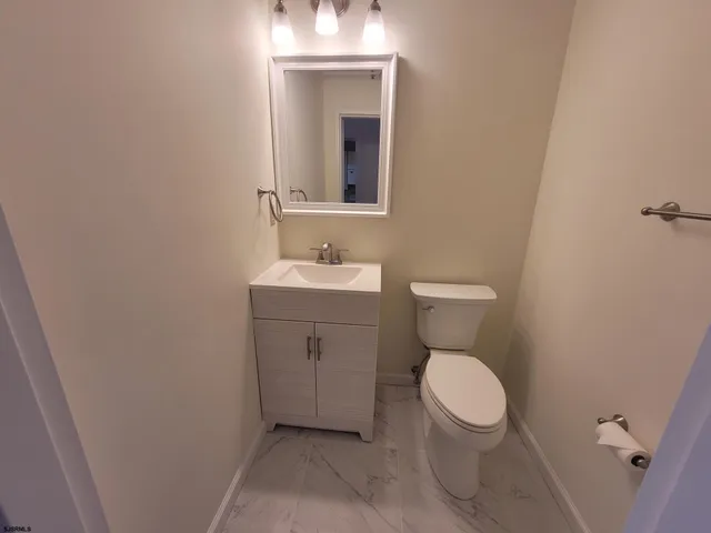 a bathroom with a sink and a washing machine
