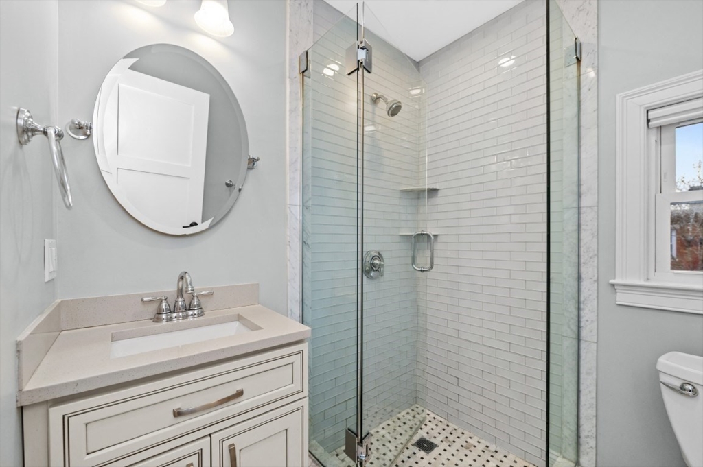 1880 Beacon Street, Unit 6 Brookline, MA 02445 - Photo 11 of 18 a bathroom with a sink a toilet and shower