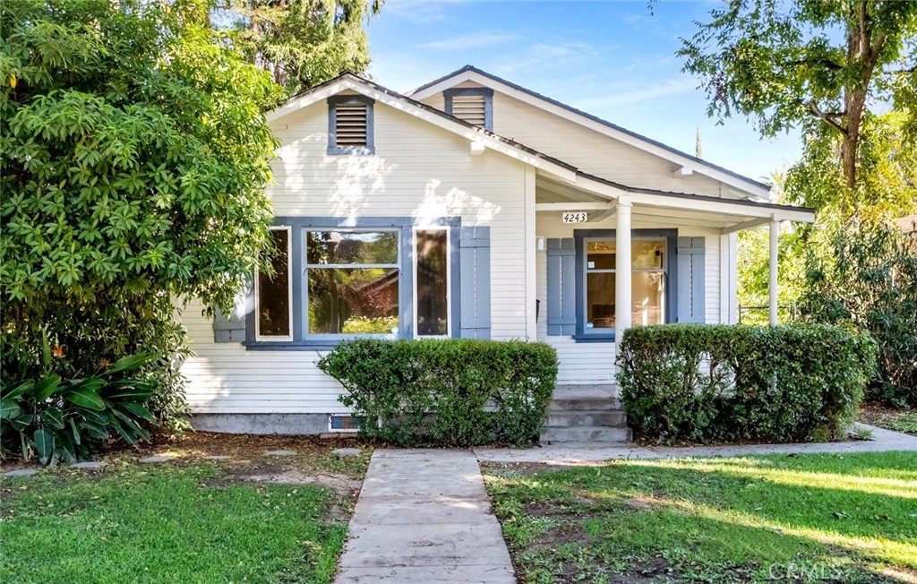 4243 Edgewood Place Riverside, CA 92506 - Photo 1 of 1 a front view of a house with garden
