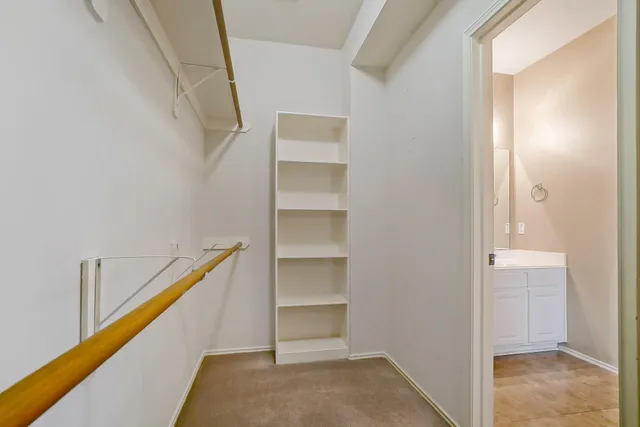 a view of an empty walk in closet