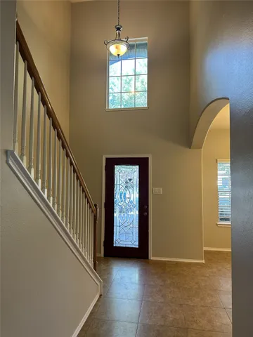 a view of a hallway with windows