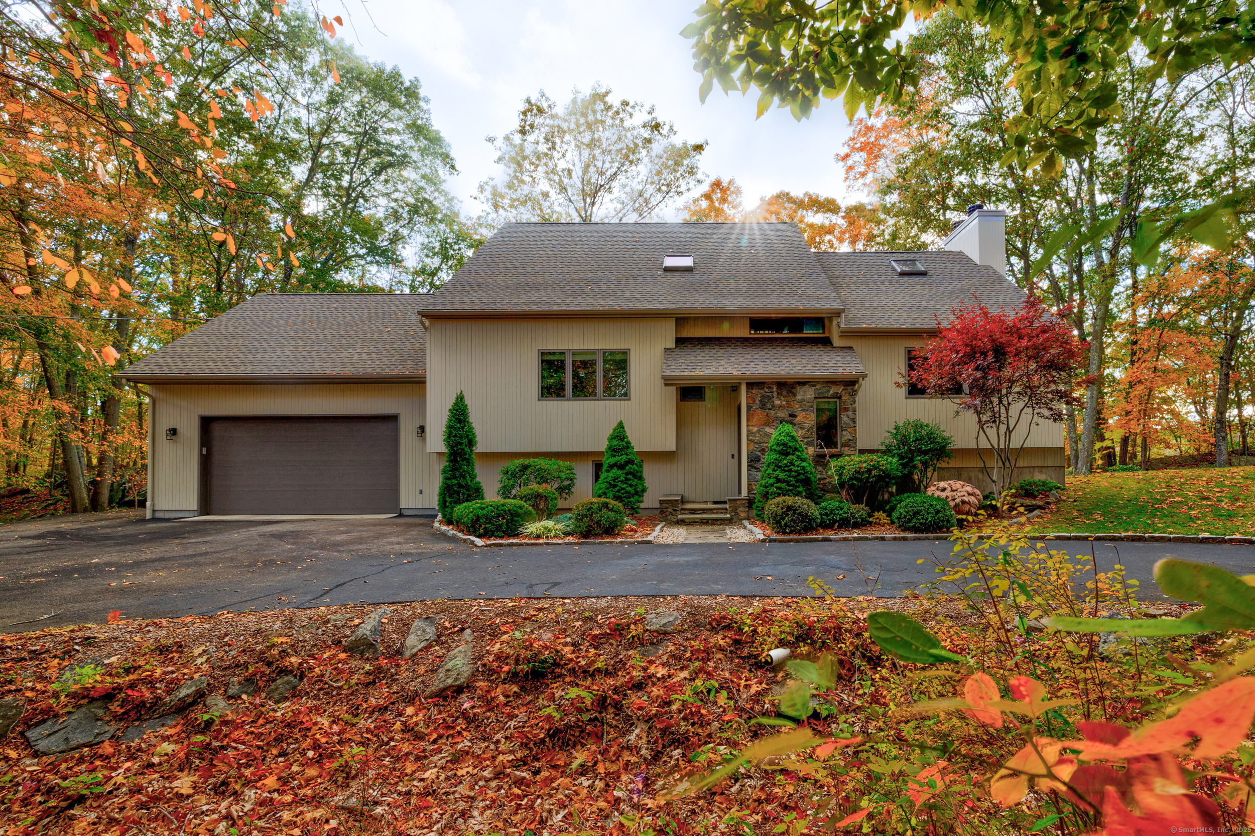 201 Mulberry Point Road Guilford, CT 06437 - Photo 1 of 1 a front view of a house with a yard and potted plants
