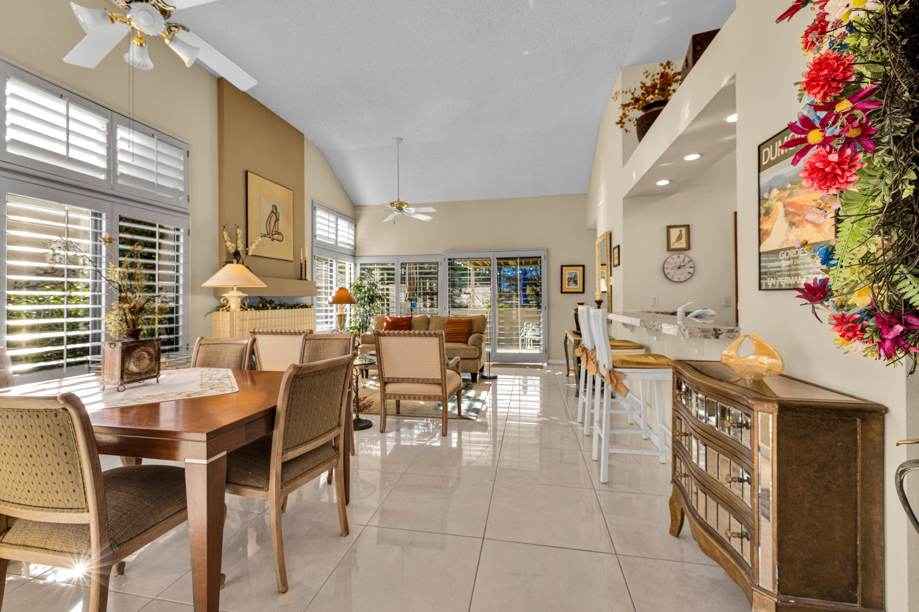 45 Verde Way Palm Desert, CA 92260 - Photo 11 of 48 a dining hall with stainless steel appliances kitchen island granite countertop a table and chairs in it