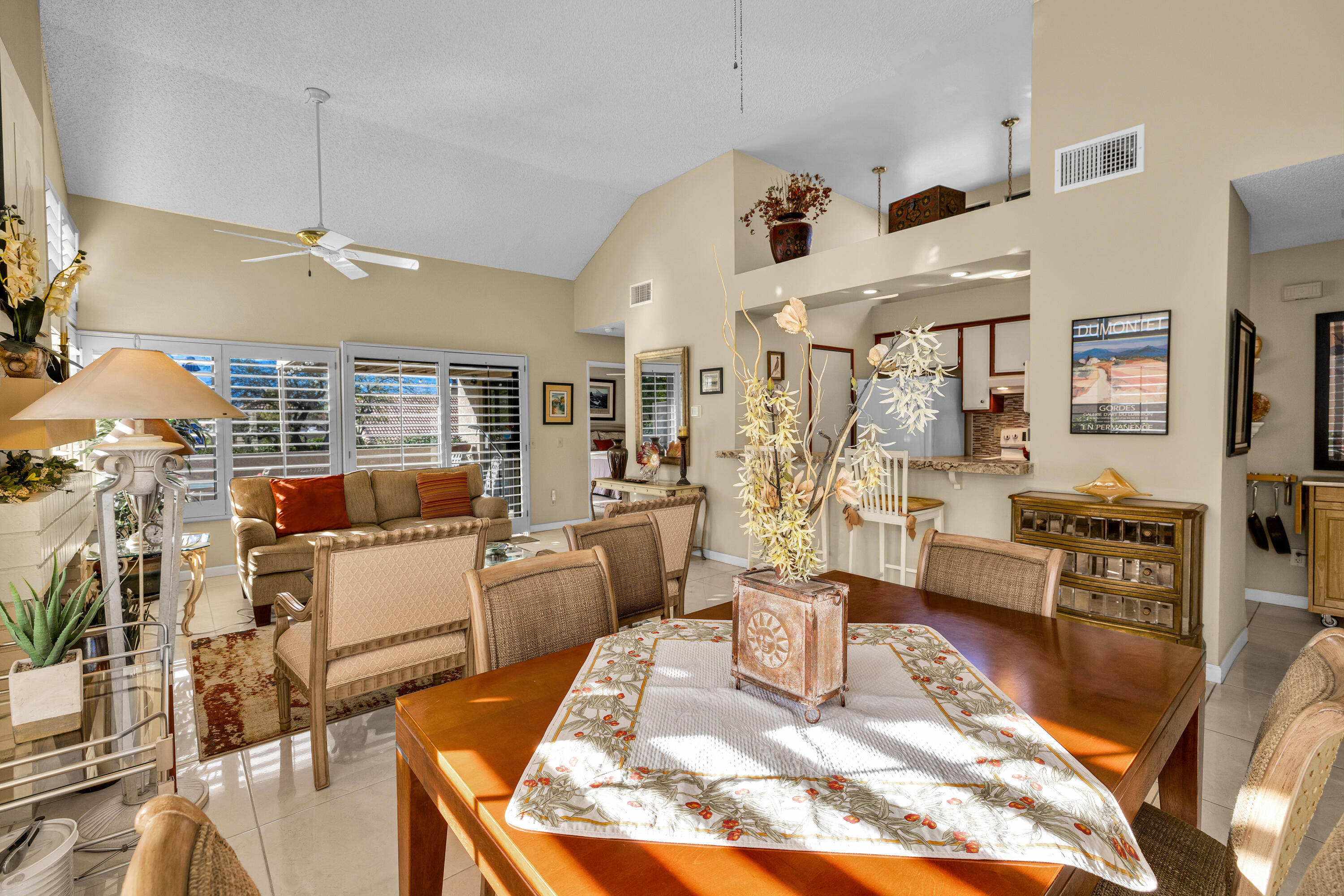 45 Verde Way Palm Desert, CA 92260 - Photo 13 of 48 a living room with fireplace furniture and a large window