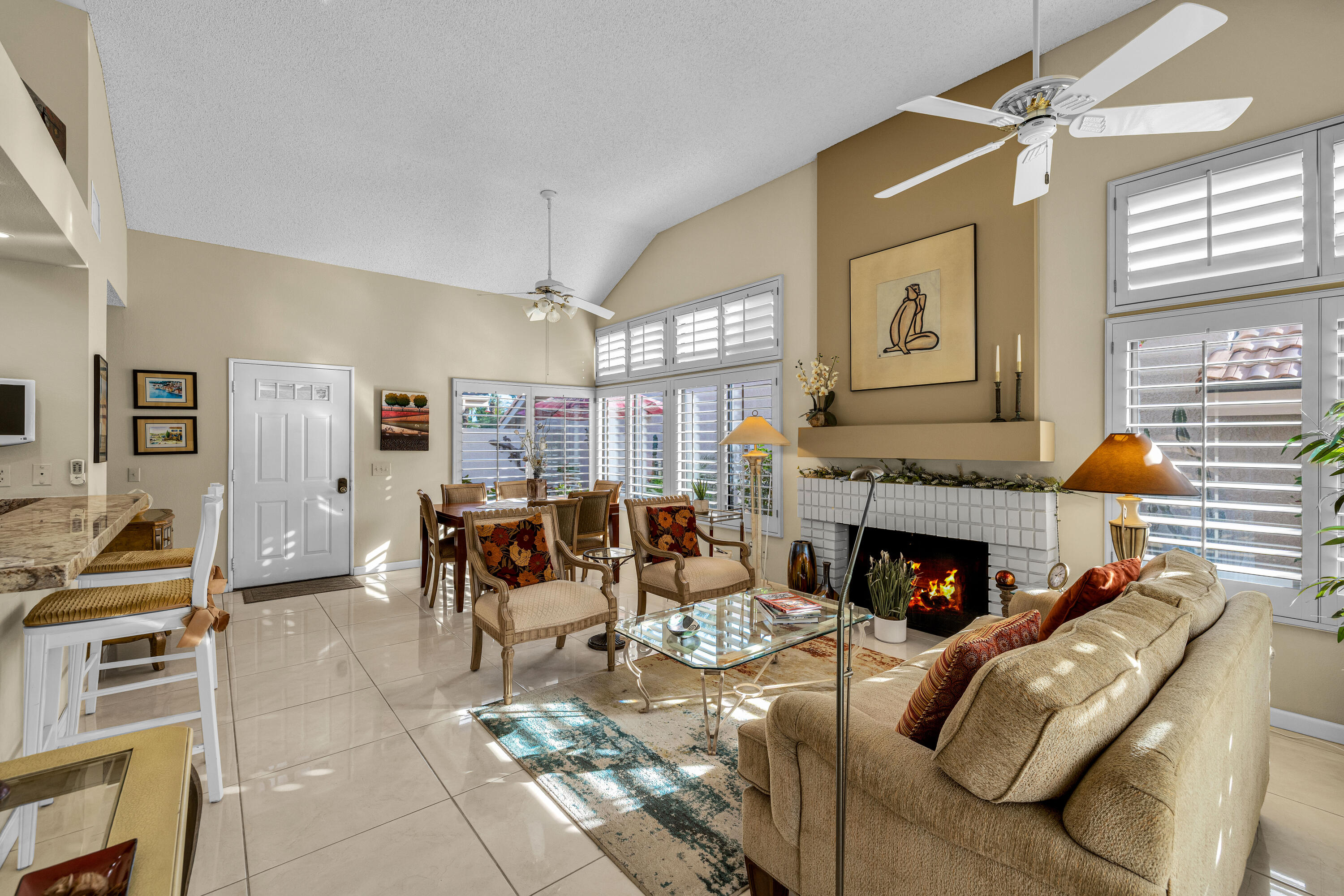45 Verde Way Palm Desert, CA 92260 - Photo 16 of 48 a living room with furniture and a fireplace