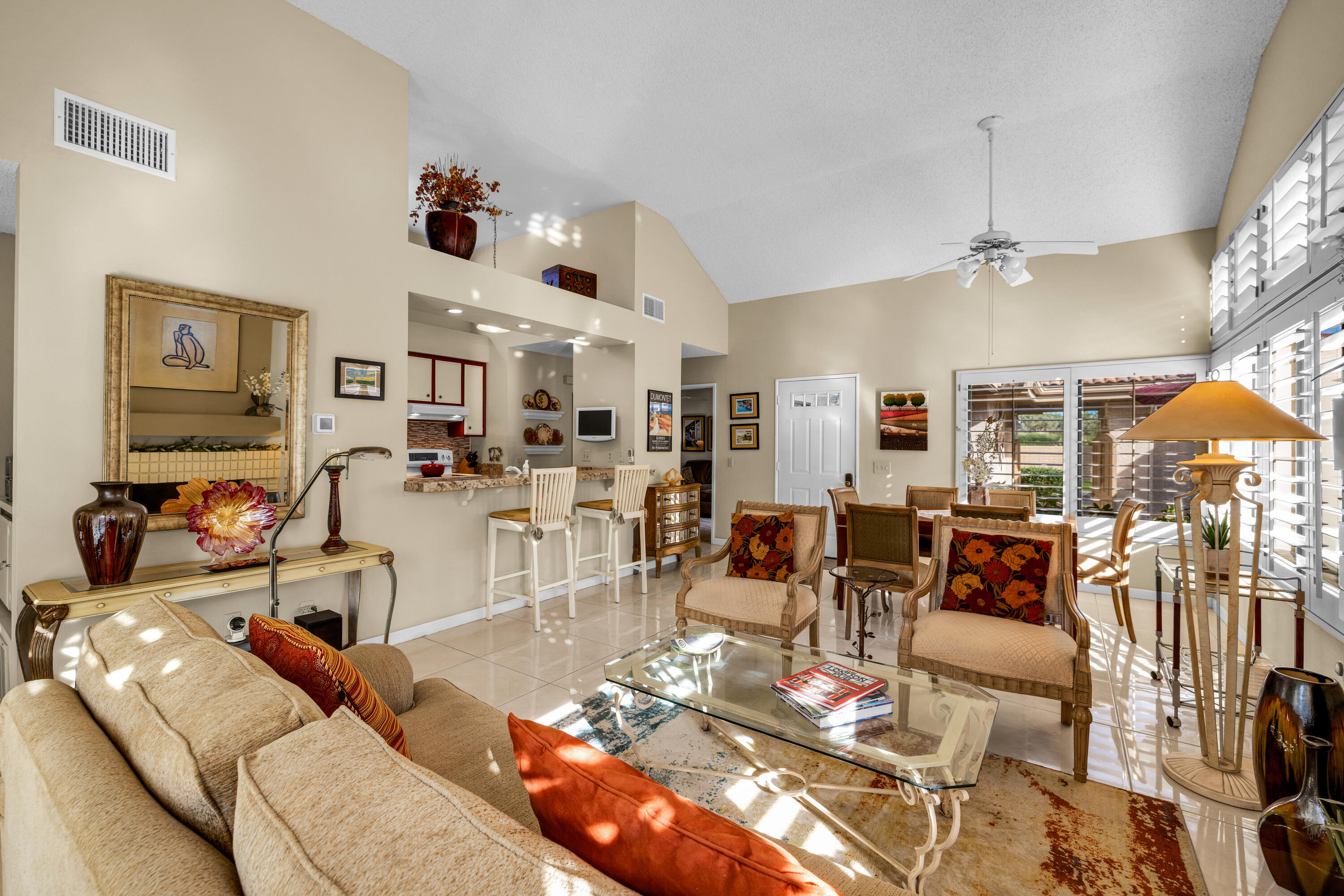 45 Verde Way Palm Desert, CA 92260 - Photo 17 of 48 a living room with lots of furniture and view of kitchen