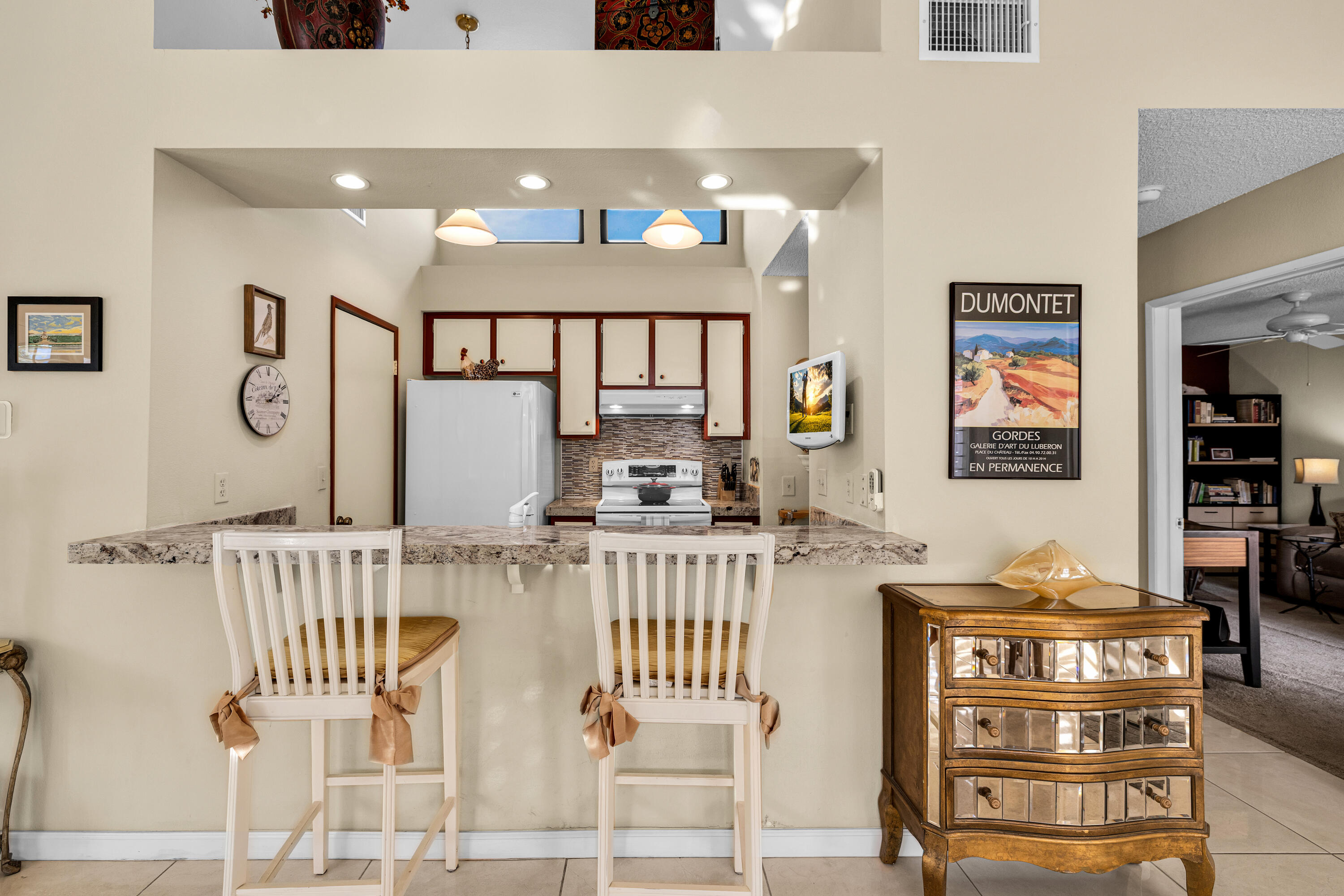 45 Verde Way Palm Desert, CA 92260 - Photo 19 of 48 a kitchen with stainless steel appliances granite countertop a sink and cabinets