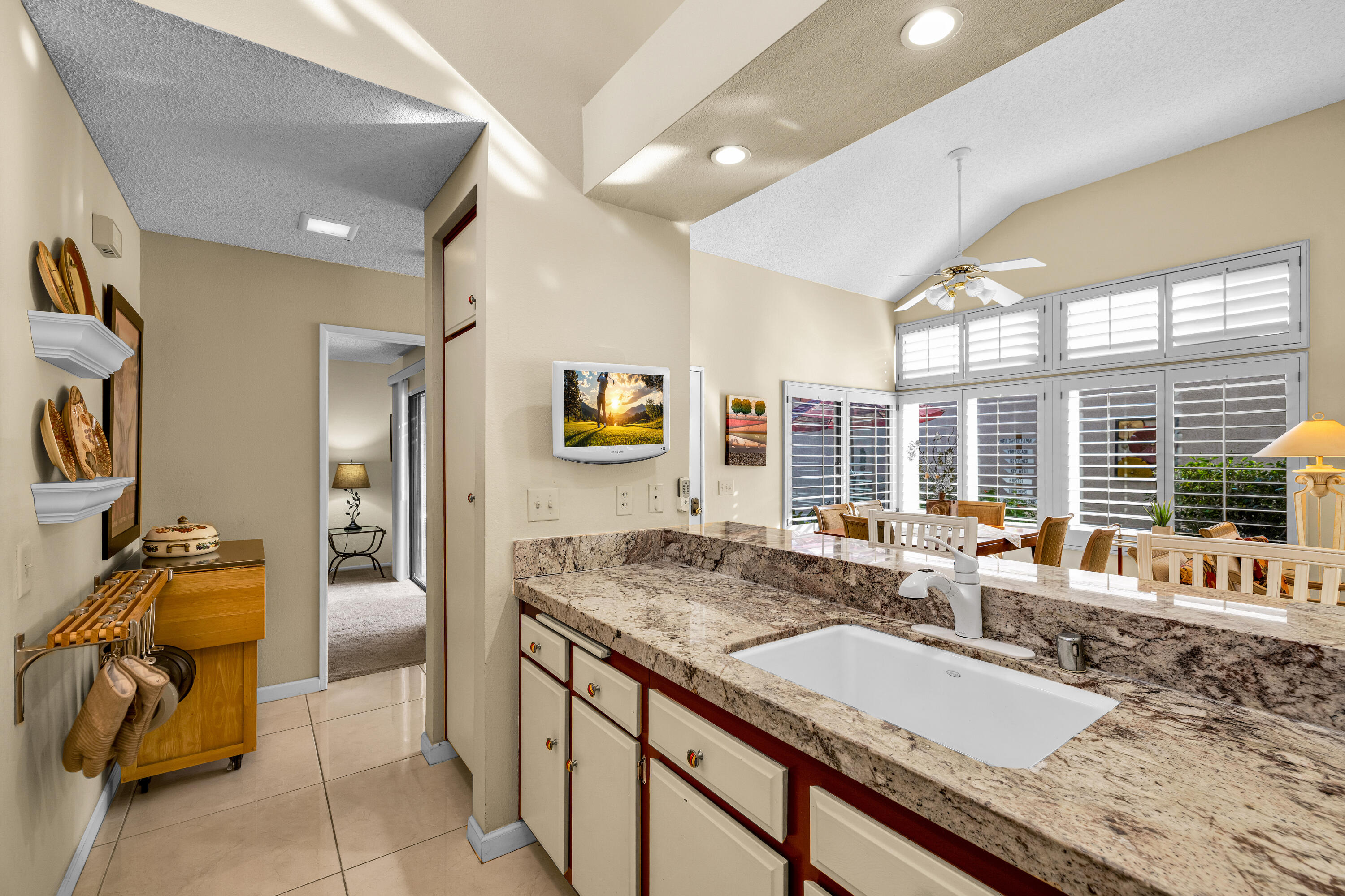 45 Verde Way Palm Desert, CA 92260 - Photo 23 of 48 a bathroom with a granite countertop sink and a large mirror