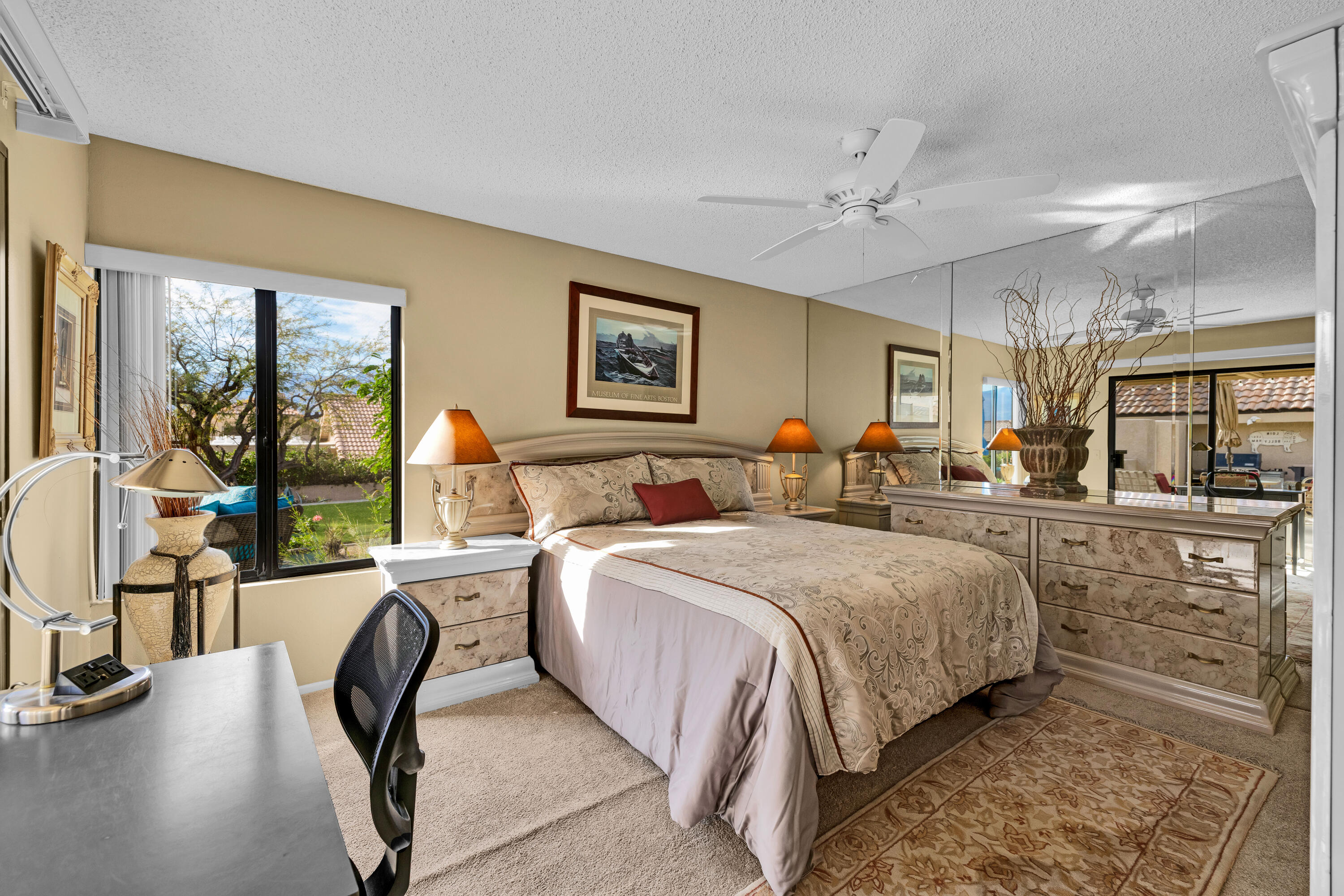 45 Verde Way Palm Desert, CA 92260 - Photo 25 of 48 a bed room with a bed and a chair