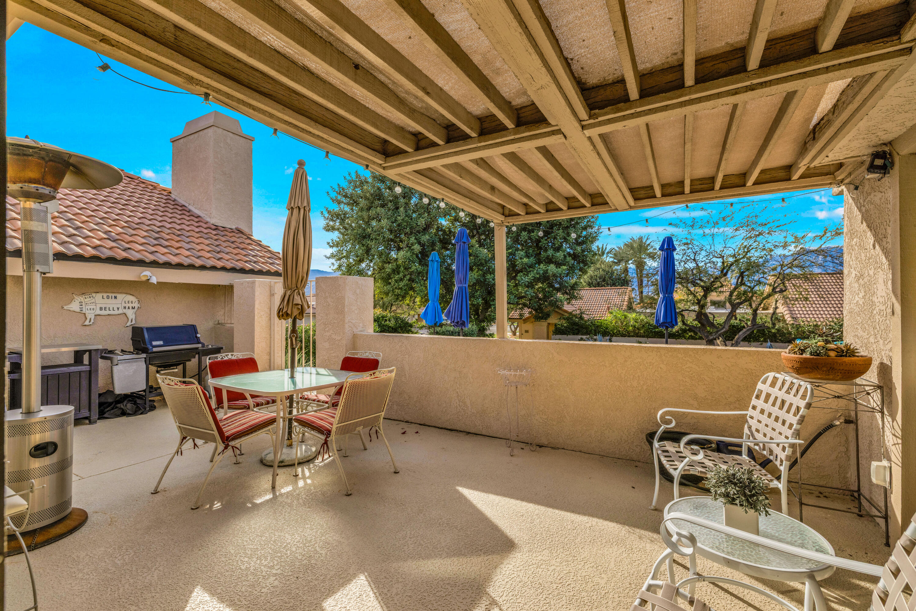 45 Verde Way Palm Desert, CA 92260 - Photo 35 of 48 a building outdoor space with patio furniture and potted plants