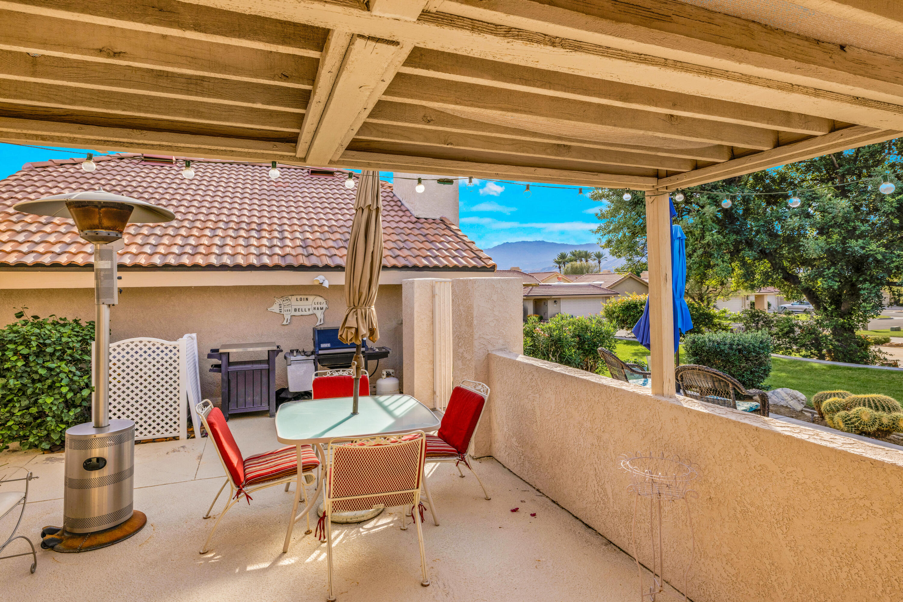 45 Verde Way Palm Desert, CA 92260 - Photo 38 of 48 a patio with glass top table and chairs