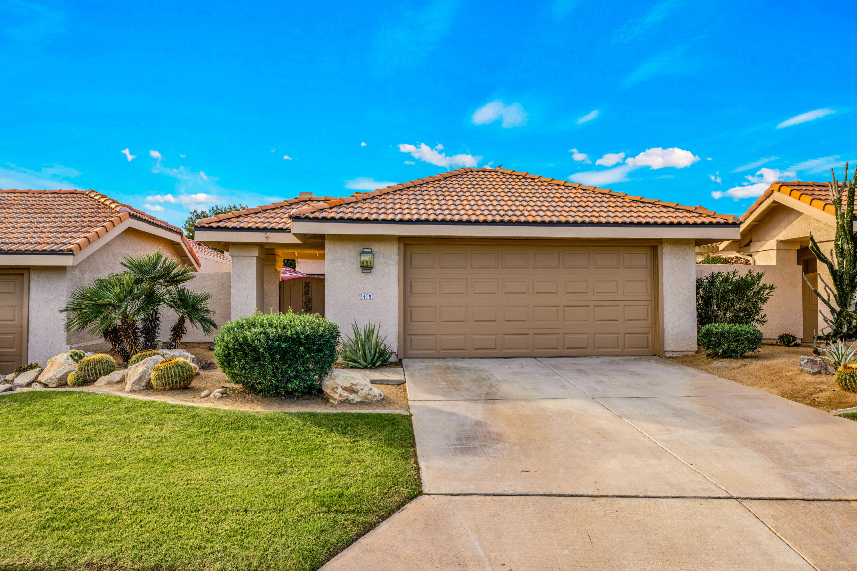 45 Verde Way Palm Desert, CA 92260 - Photo 40 of 48 a front view of house with yard