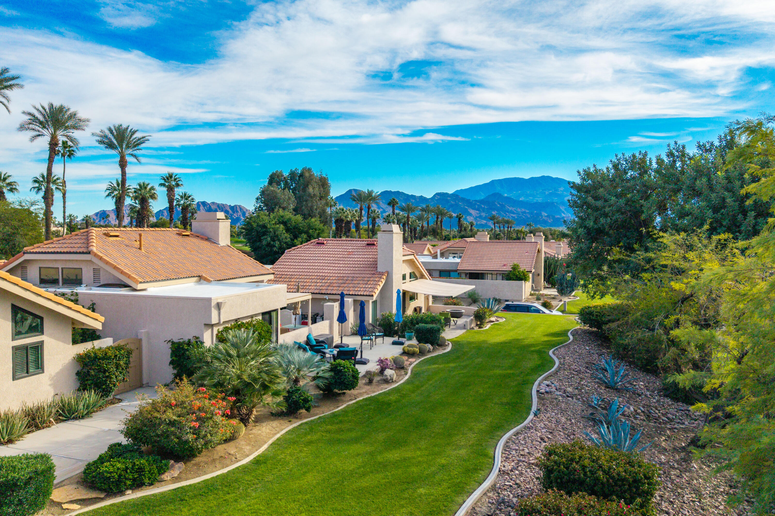 45 Verde Way Palm Desert, CA 92260 - Photo 5 of 48 a view of house with garden and mountains