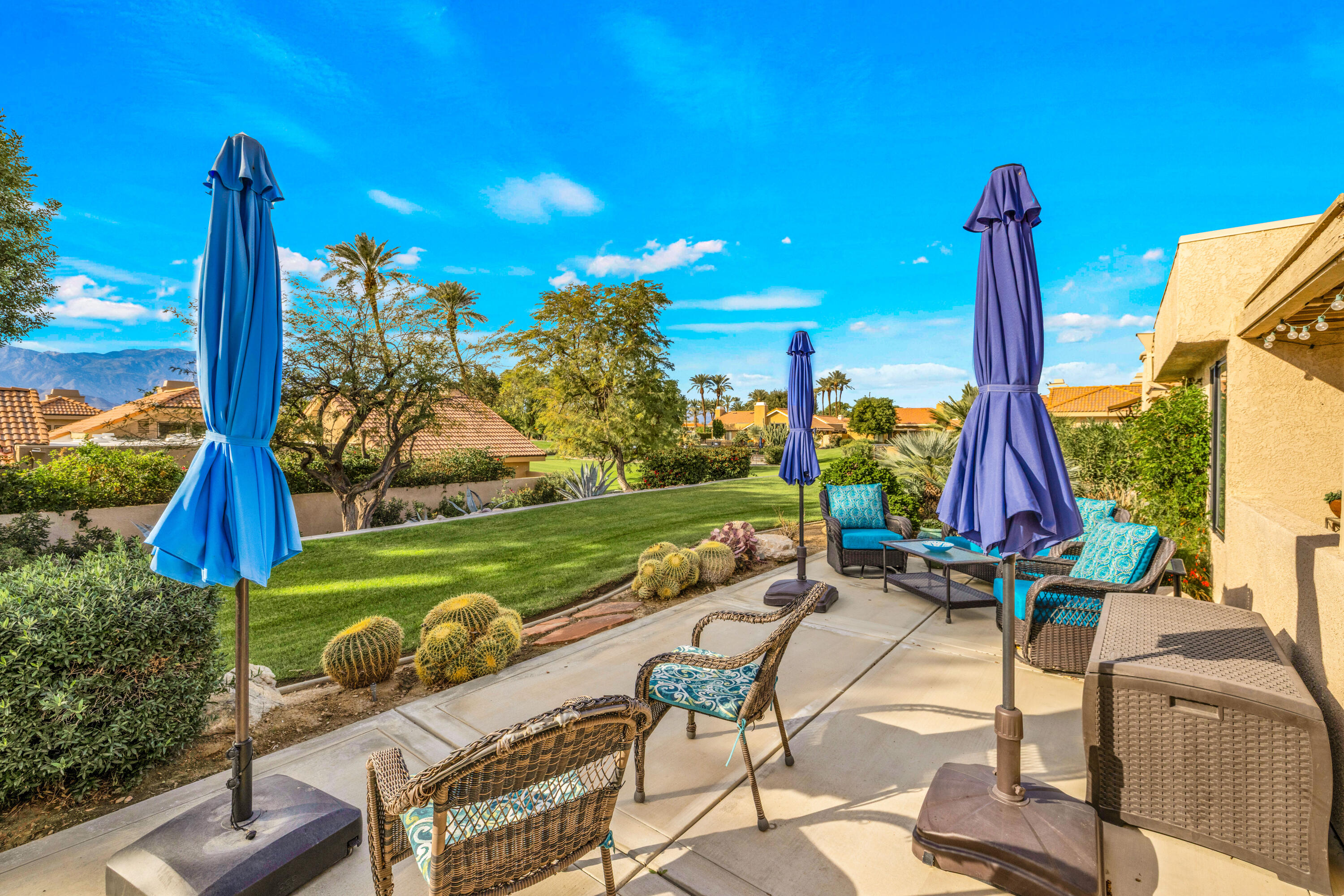 45 Verde Way Palm Desert, CA 92260 - Photo 6 of 48 a view of a terrace with furniture and garden