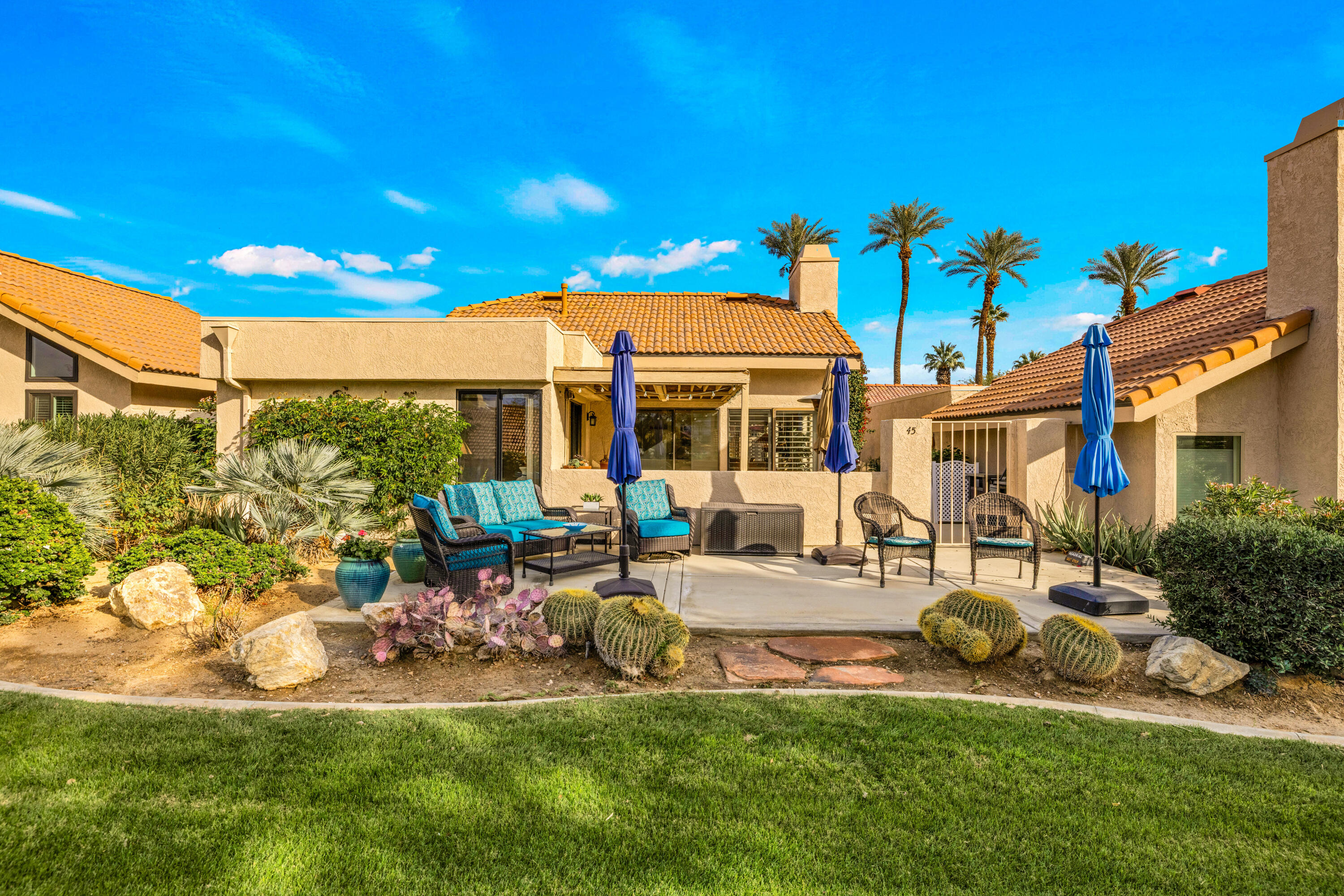 45 Verde Way Palm Desert, CA 92260 - Photo 7 of 48 a view of a house with backyard porch and sitting area