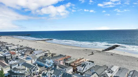 an aerial view of beach and ocean