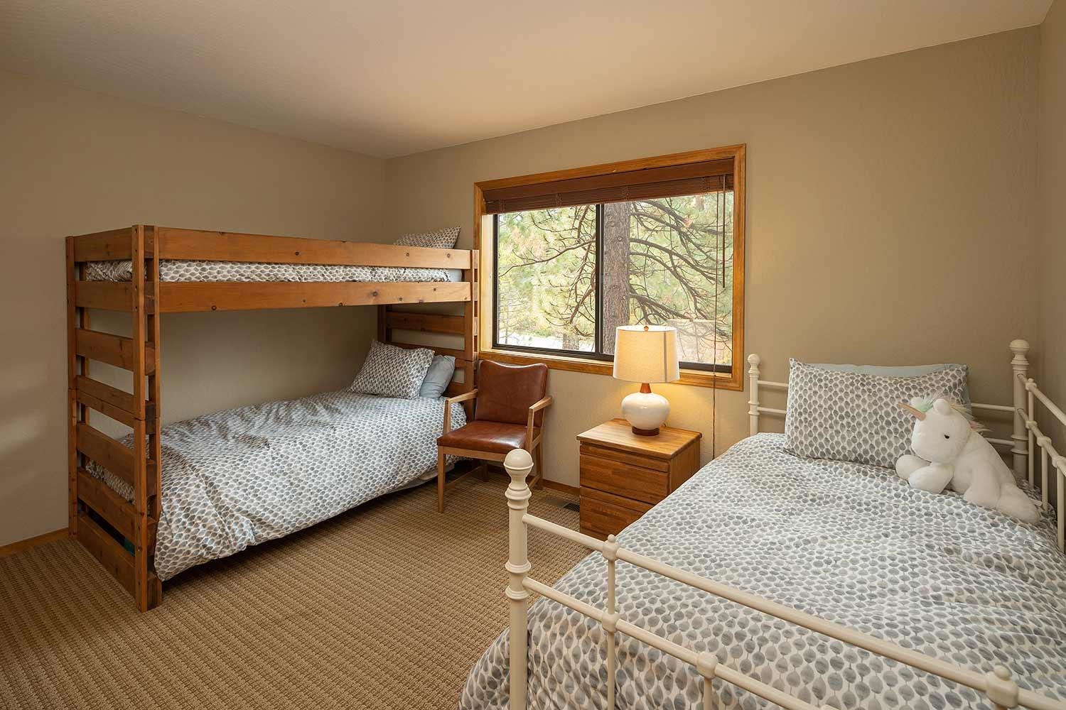 342 Skidder Trail Truckee, CA 96161 - Photo 11 of 21 a bedroom with a bed and wooden floor