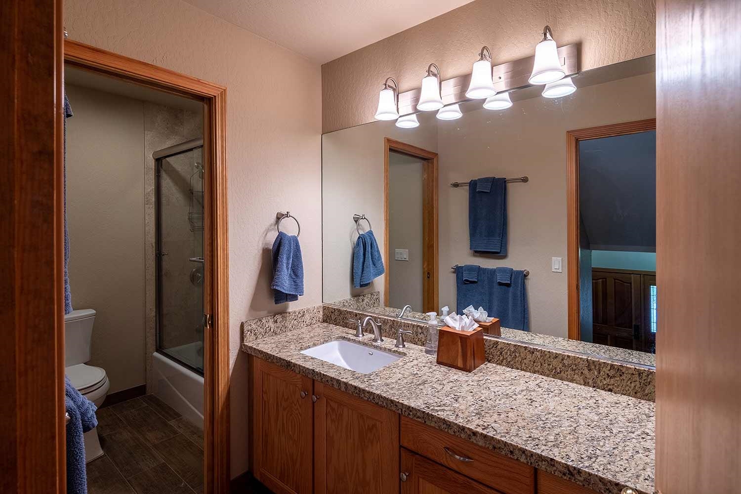 342 Skidder Trail Truckee, CA 96161 - Photo 12 of 21 a bathroom with a granite countertop double vanity sink and a mirror