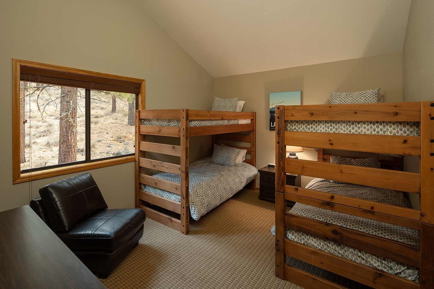 342 Skidder Trail Truckee, CA 96161 - Photo 15 of 21 a bedroom with a bed and a dresser next to a window