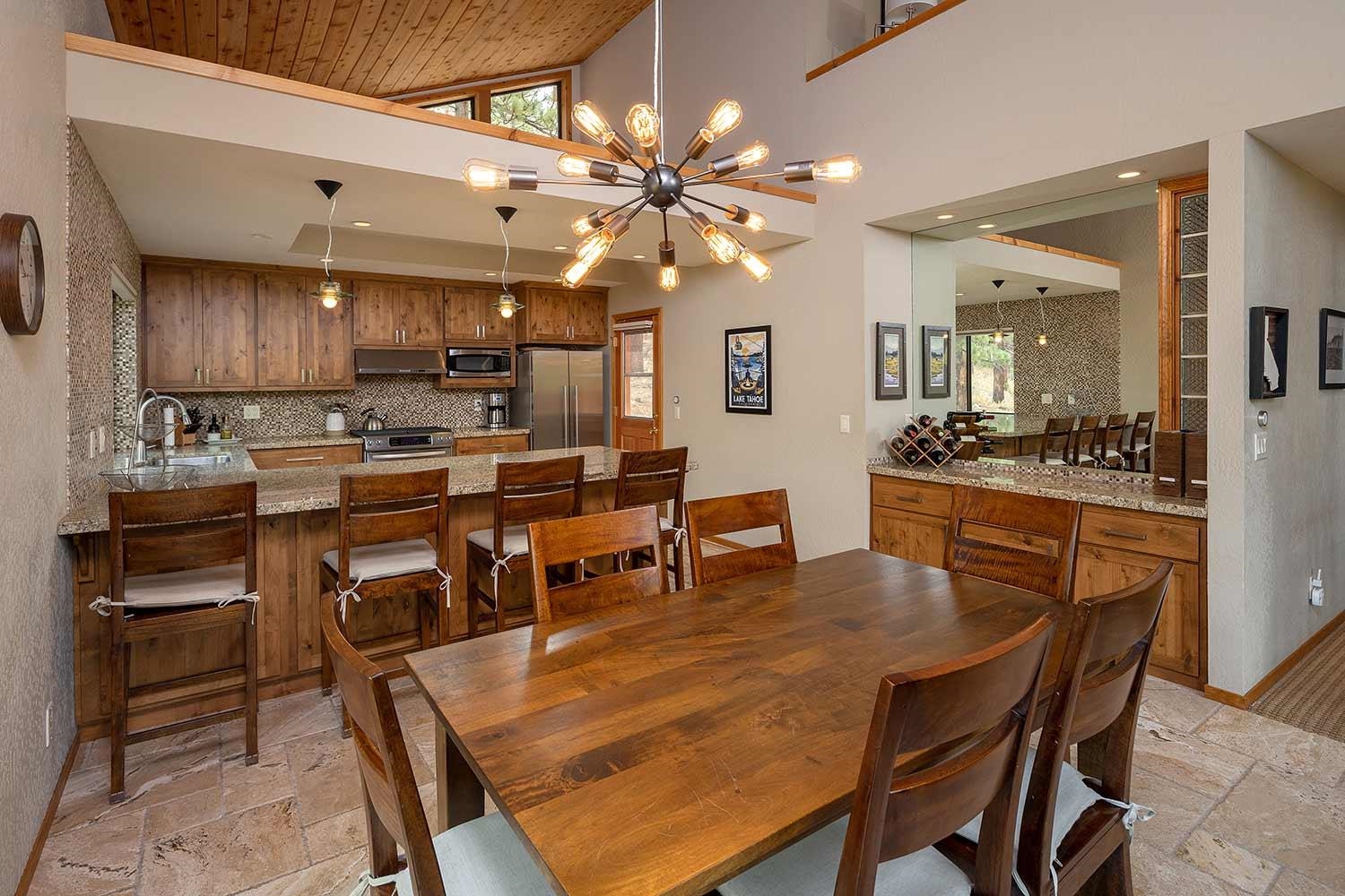 342 Skidder Trail Truckee, CA 96161 - Photo 5 of 21 a dining area with a table chairs and a kitchen view