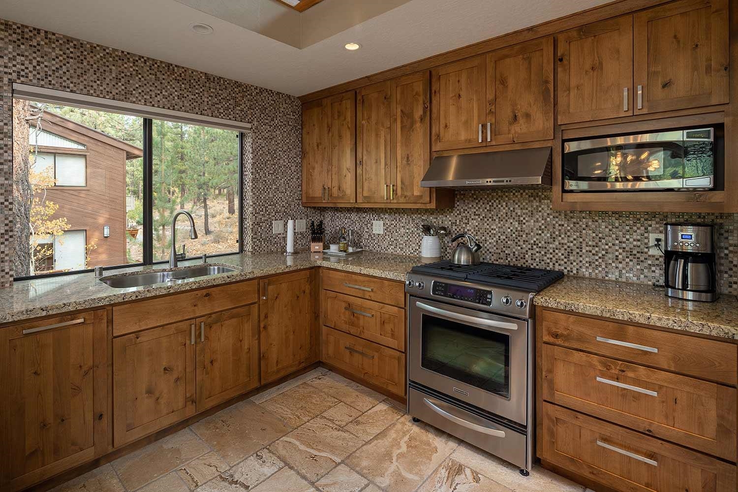 342 Skidder Trail Truckee, CA 96161 - Photo 7 of 21 a kitchen with granite countertop cabinets stainless steel appliances and a sink
