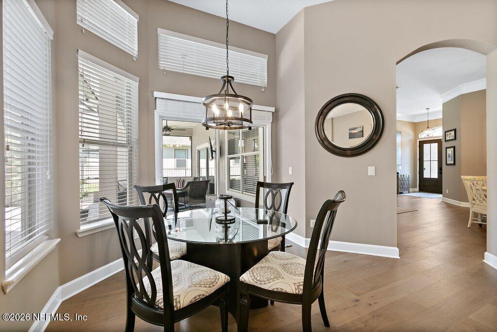 841 Ifield Road St. Augustine, FL 32095 - Photo 18 of 69 a view of a dining room with furniture window and wooden floor