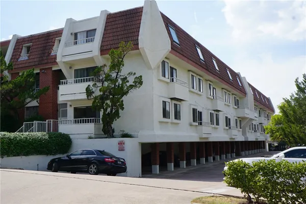 a front view of a building with a street