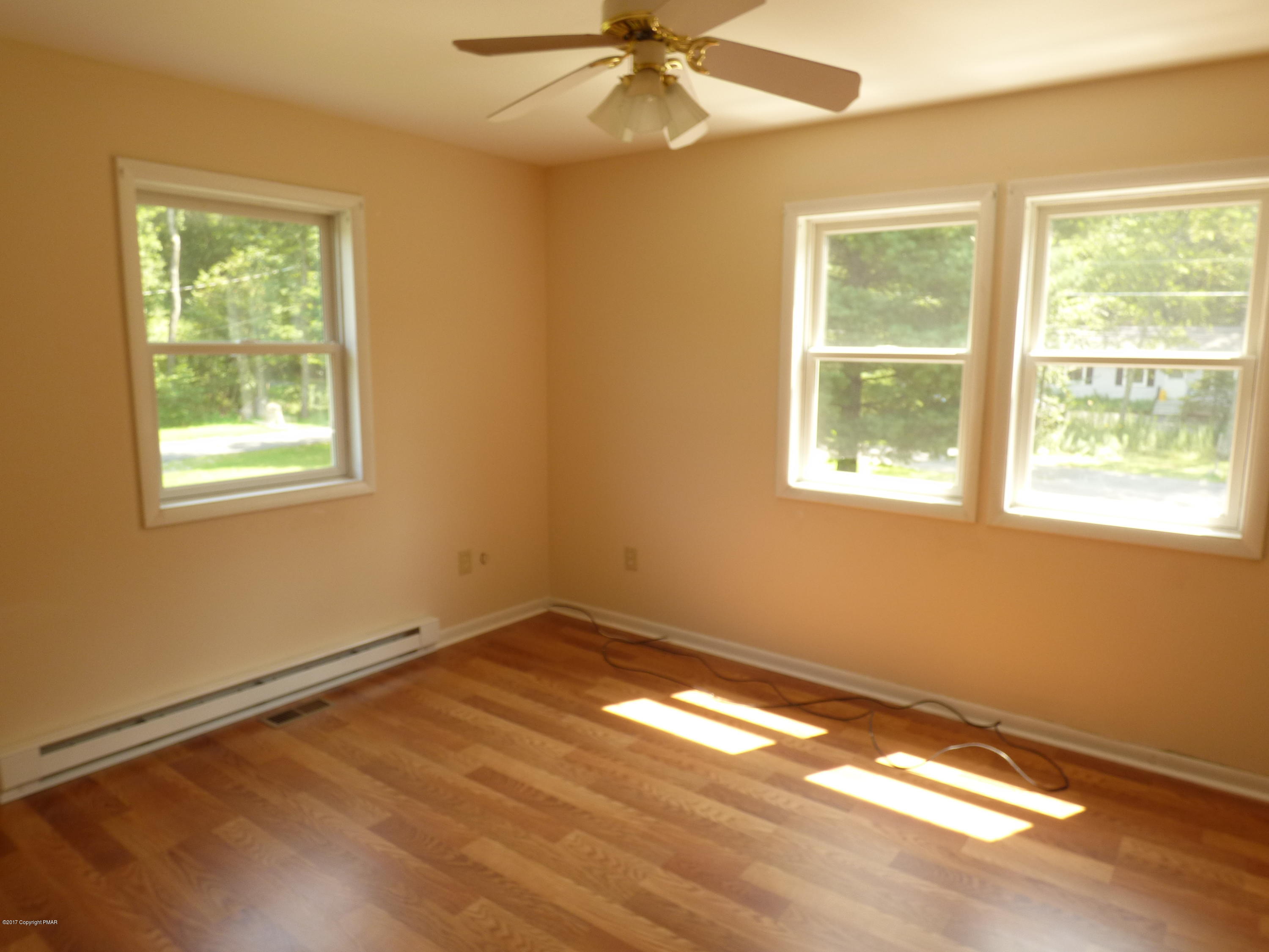 1178 Mattioli Road Bartonsville, PA 18321 - Photo 15 of 21 a view of an empty room with wooden floor and a window