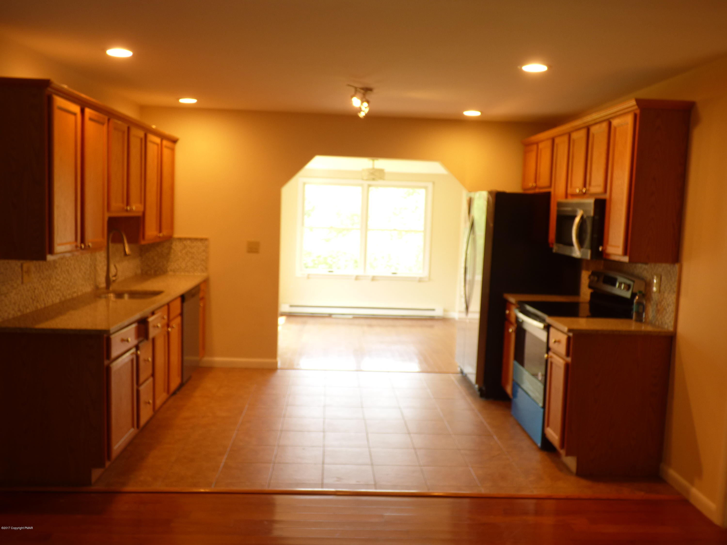 1178 Mattioli Road Bartonsville, PA 18321 - Photo 9 of 21 a kitchen with stainless steel appliances a refrigerator and a stove