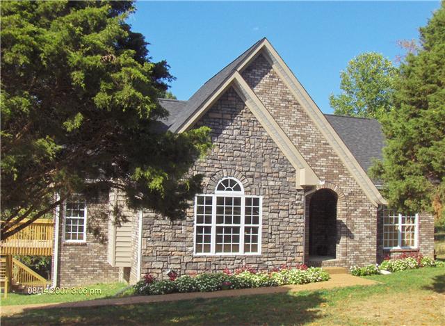 9151 Buck Litton Road Lyles, TN 37098 - Photo 1 of 20 front view of a house with a yard