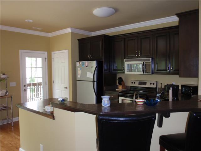 9151 Buck Litton Road Lyles, TN 37098 - Photo 12 of 20 a kitchen with a sink appliances and cabinets