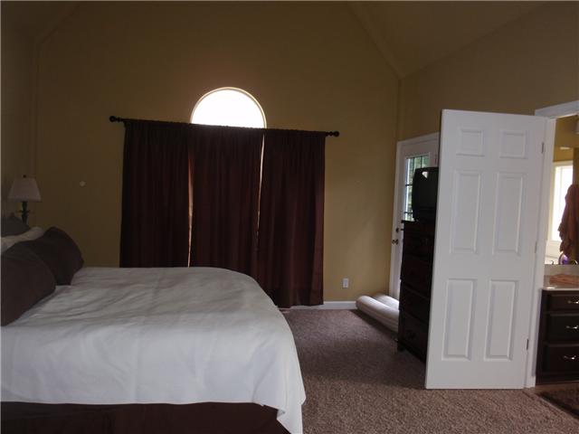 9151 Buck Litton Road Lyles, TN 37098 - Photo 17 of 20 a bedroom with a bed and a window