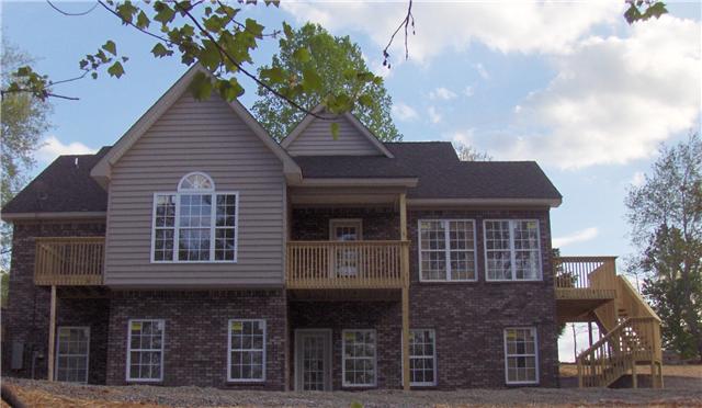 9151 Buck Litton Road Lyles, TN 37098 - Photo 3 of 20 a front view of a house with a garden