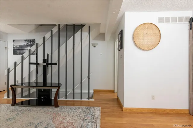 a view of a livingroom with furniture and an entryway