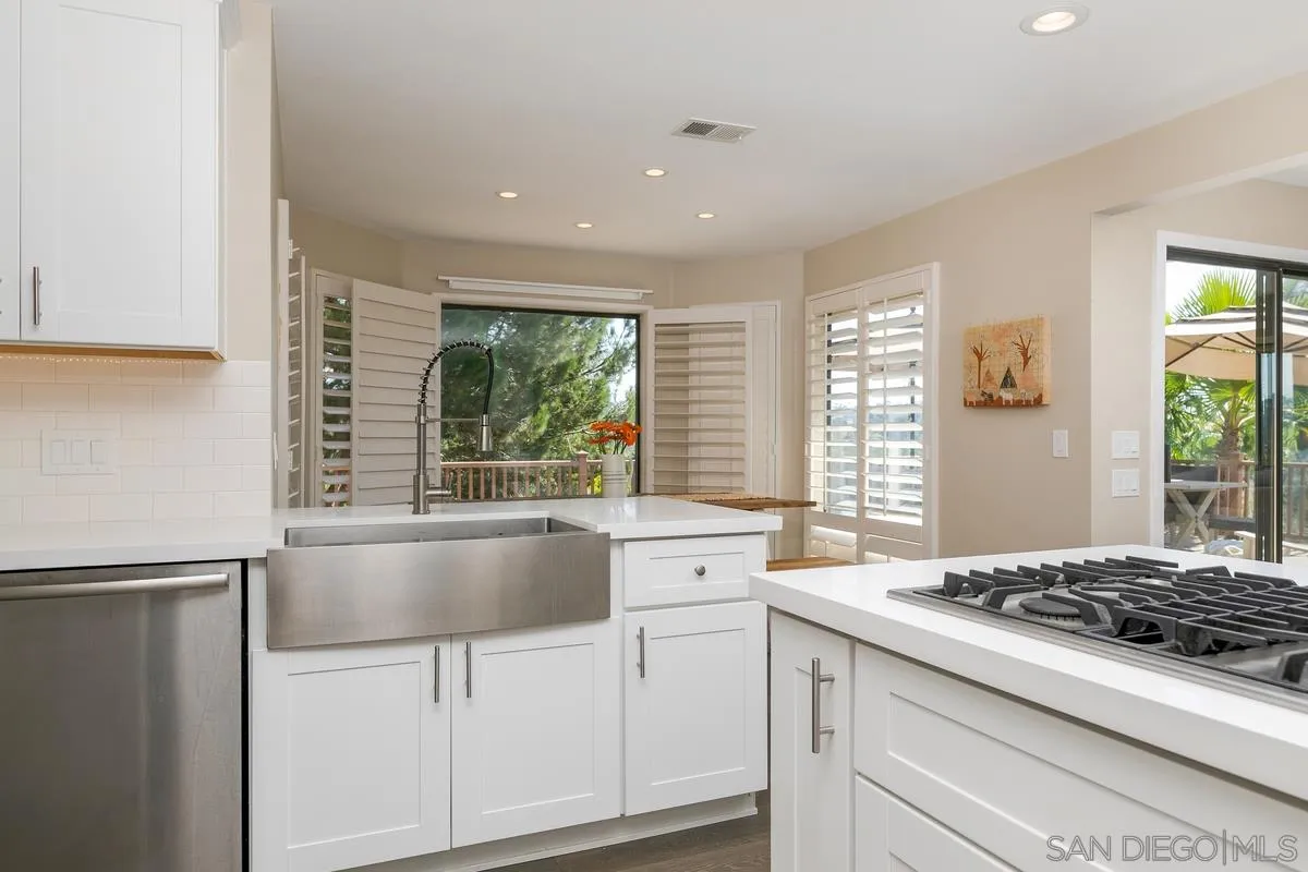 1122 Rancho Encinitas Drive Encinitas, CA 92024 - Photo 10 of 39 a kitchen with granite countertop a sink and a stove