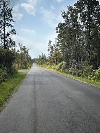 a view of a road with a yard