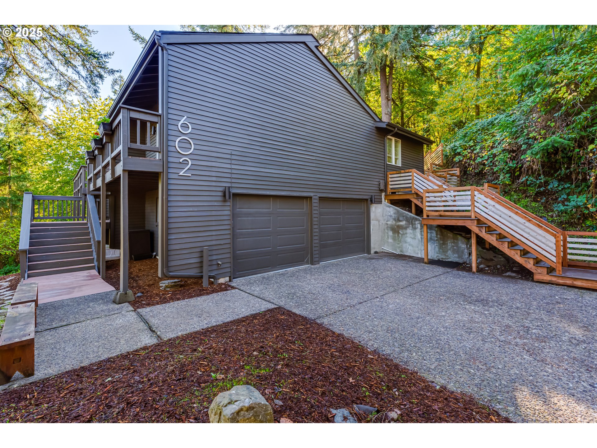 a view of house with backyard and deck