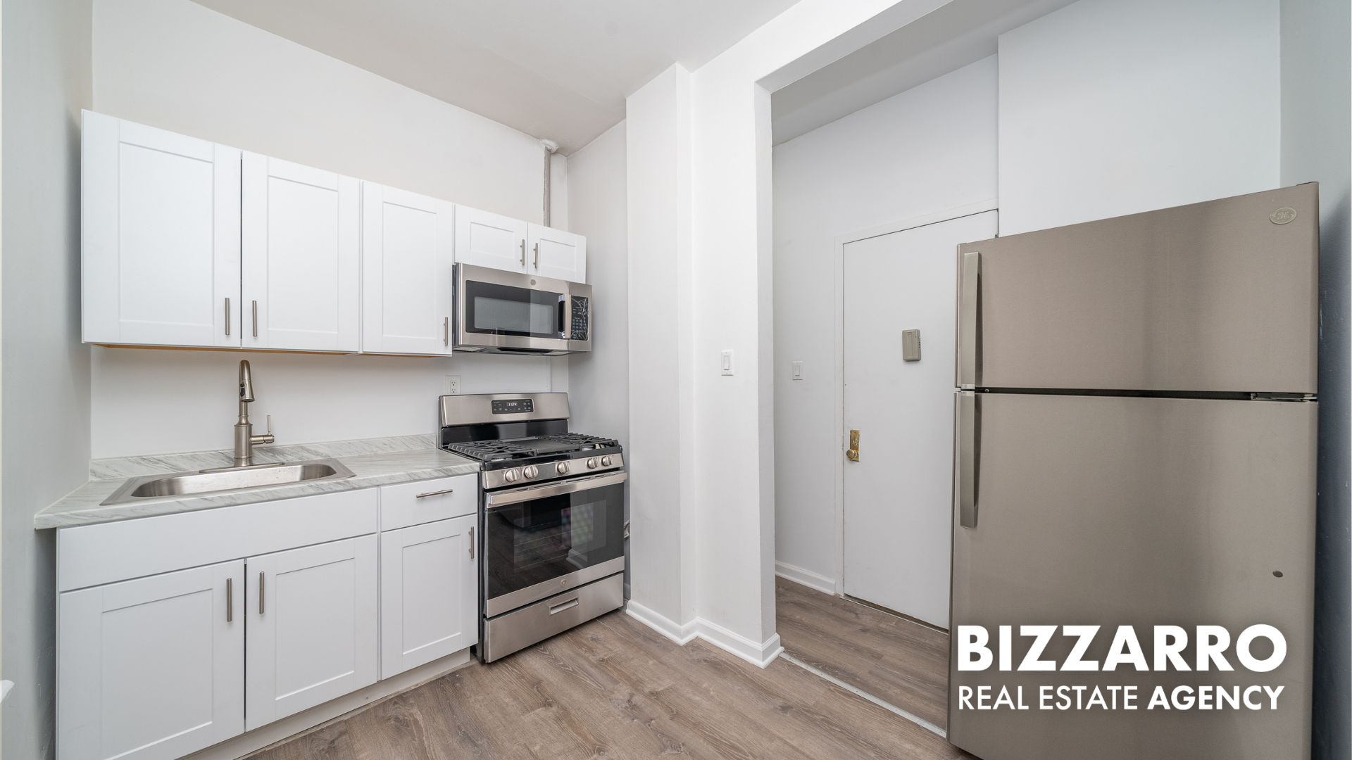 Undisclosed Address Manhattan, NY 10031 - Photo 11 of 20 a kitchen with stainless steel appliances granite countertop a refrigerator a stove a sink and a microwave