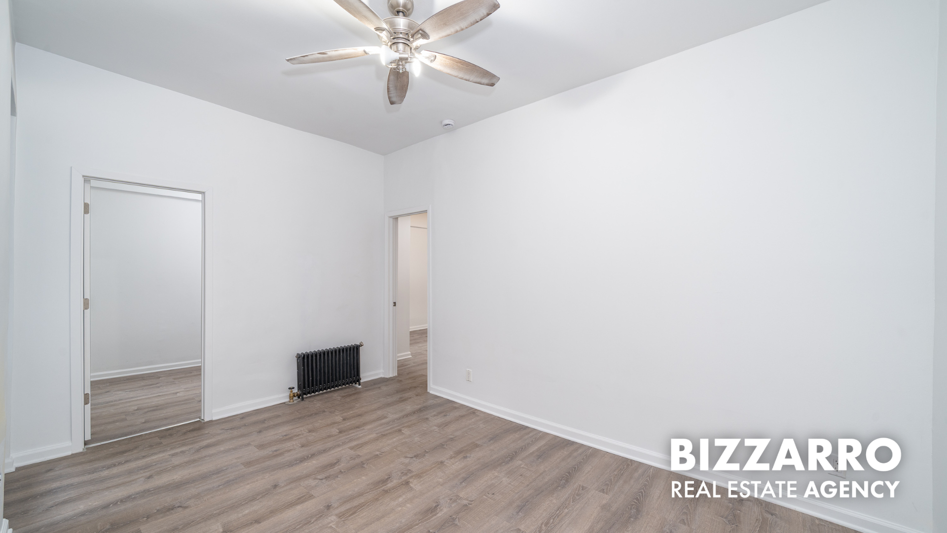 Undisclosed Address Manhattan, NY 10031 - Photo 4 of 20 a view of an empty room with wooden floor