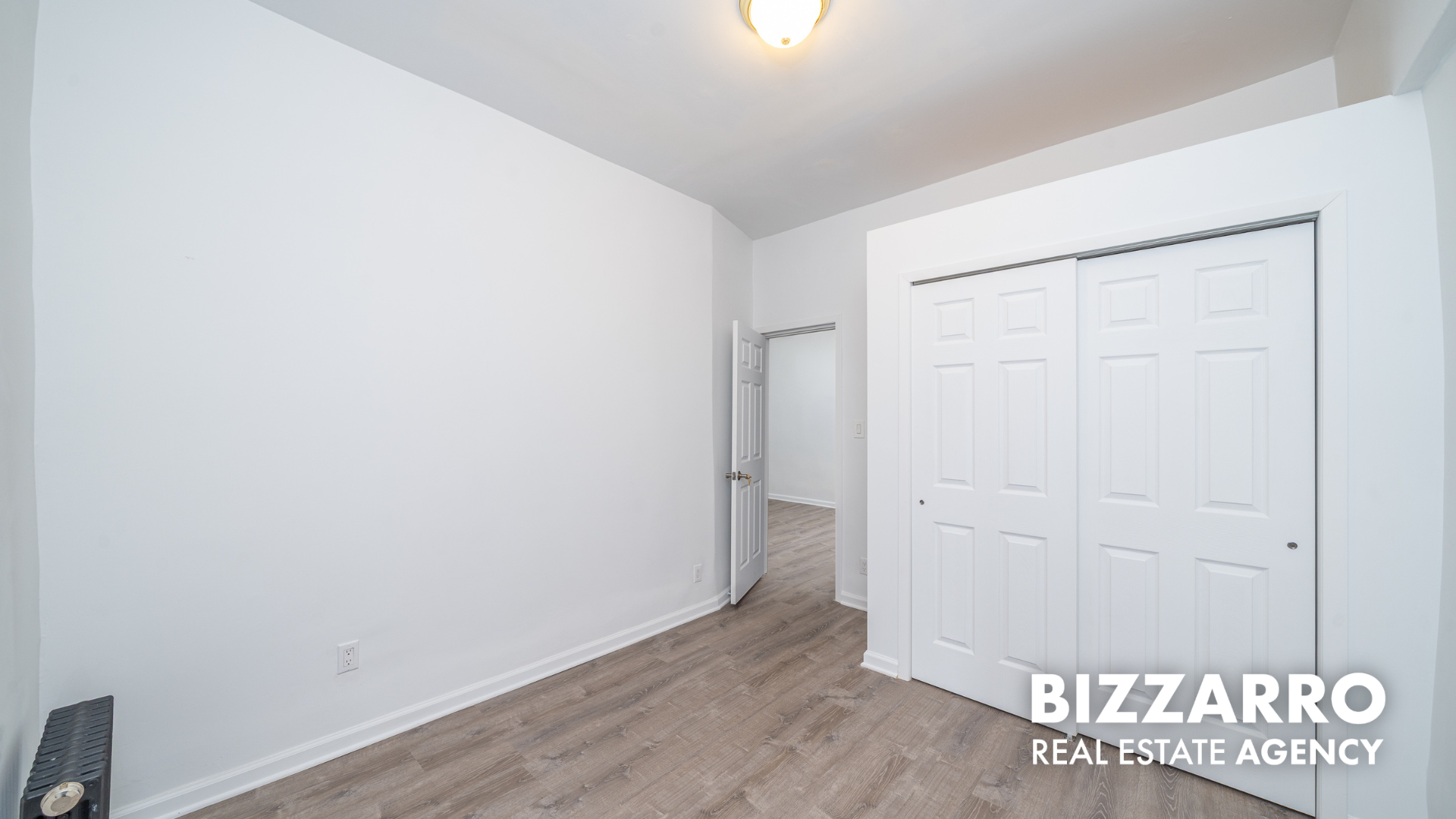 Undisclosed Address Manhattan, NY 10031 - Photo 6 of 20 an empty room with wooden floor