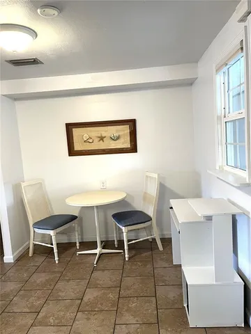 a bedroom with bed and window