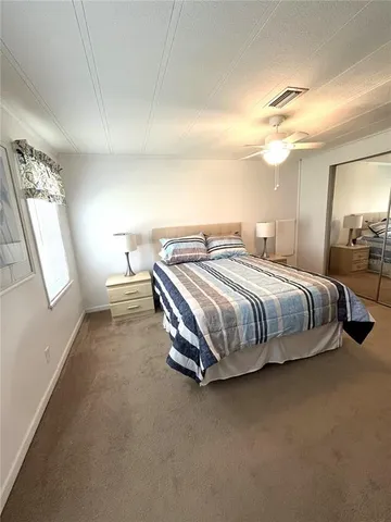 a bathroom with a granite countertop sink mirror and a shower