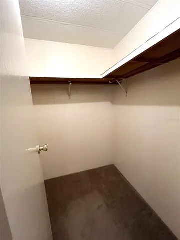 a bedroom with bed and window