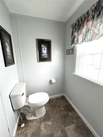 a balcony with furniture and a window